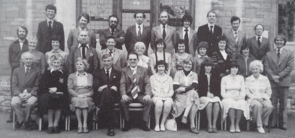 The staff of Fitzmaurice Grammar School shortly before it merged with Trinity secondary modern school to form the comprehensive St Laurence school in 1980. Back row, left to right, Alistair Thomson, Tony Hull, Geoff Swift, Peter Knight, John Warburton, John Blowers, Stuart Ferguson, Tim Wilbur, Bob Hawkes, Harry Haddon, John Blake. Centre row: Joan Davis, Lynne Powell, Doug Anderson, Colin Steele, Virginia Evans, Joan Van Ryssen, Margaret Osbourne, Mireille (French Assistante), Sally Burden, Margaret Gadd. Front row: Ken Revill, Marilyn Maundrell, Noreen Brady, Sid Johnson, Gerald Reid (Headmaster), Meg Tottle-Smith, Enid Wicheard, Diane Satterthwaite, Liz Buchanan, Margaret Hore. Picture via Keith Berry. (Berry 1998)