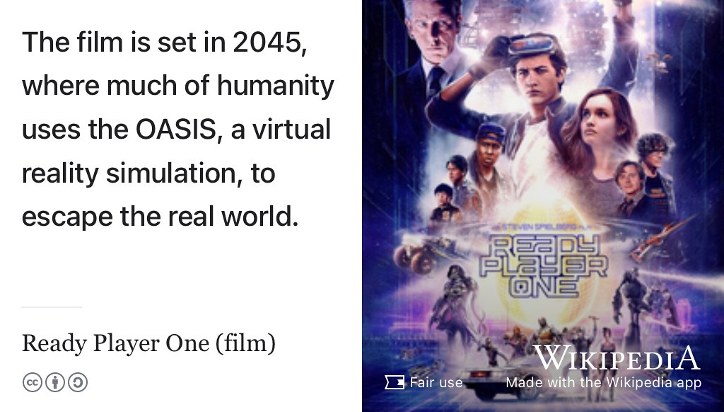 Ready Player One is set in 2045, where much of humanity uses the OASIS, a virtual reality simulation, to escape the real world. (Spielberg 2018) Fair use image from Wikimedia Commons adapted using the Wikipedia App